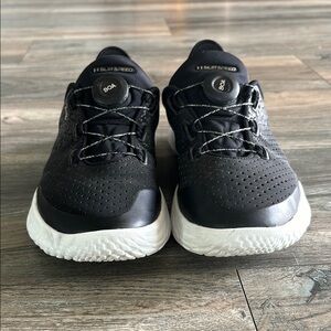 Men UA SlipSpeed Athletic Shoes, colors are black and white.